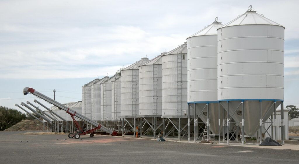 Reach Us for Any Queries Industrial grain silos in Tungamah, Victoria, showcasing agricultural infrastructure.